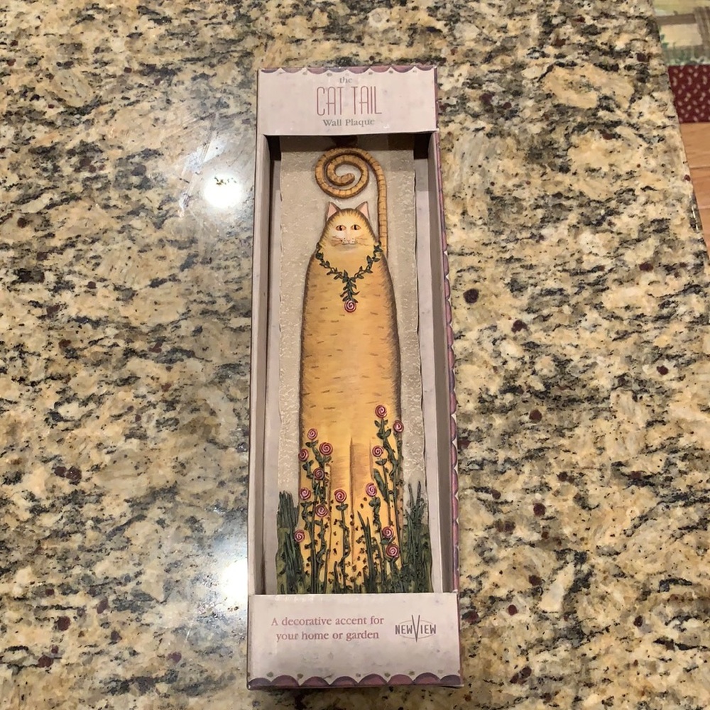 The cat tail wall plaque.
